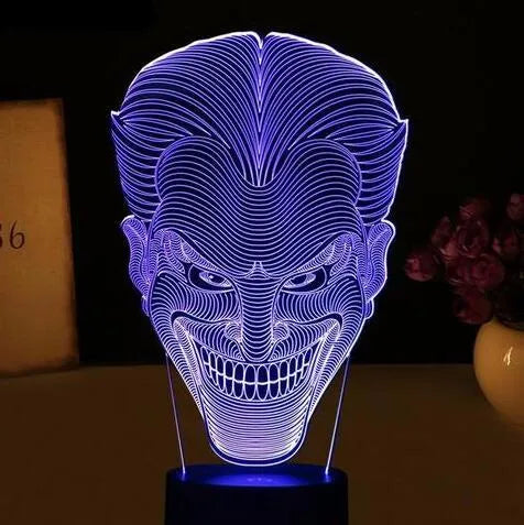 USB-powered 3D acrylic LED lamp showing multiple colour options on a desk