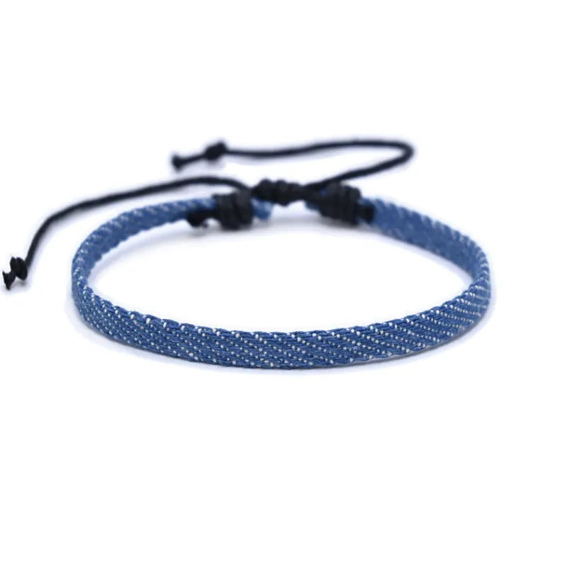 Unisex denim fabric bracelet with an attached carrying strap in a selection of colours.