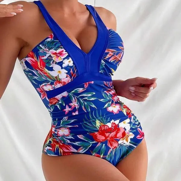 Women's floral print backless one-piece swimsuit on a hanger