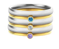 Geometric titanium steel ring with superimposed December birthstones and engraved detail.