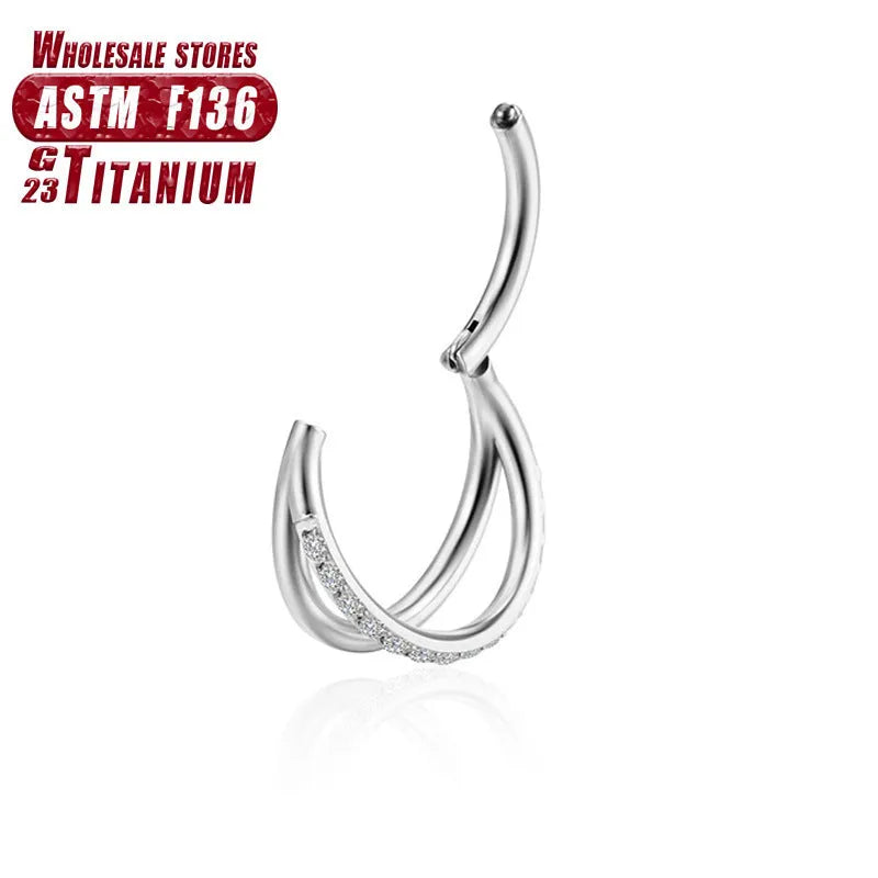 Titanium alloy fork-style nose ring on a plain background, showing the corkscrew shape and post.