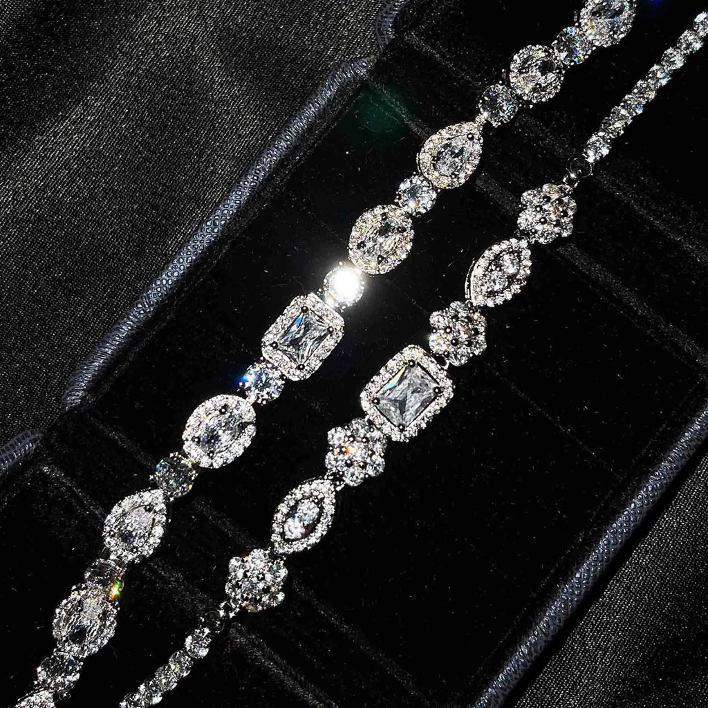 Women's sterling silver-plated bracelet with zircon stones on a geometry-patterned chain.