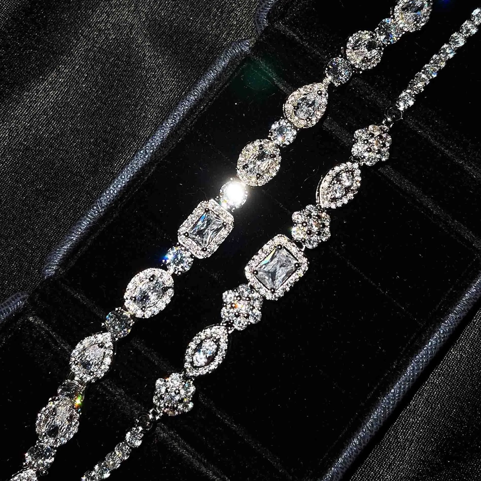 Women's sterling silver-plated bracelet with zircon stones on a geometry-patterned chain.