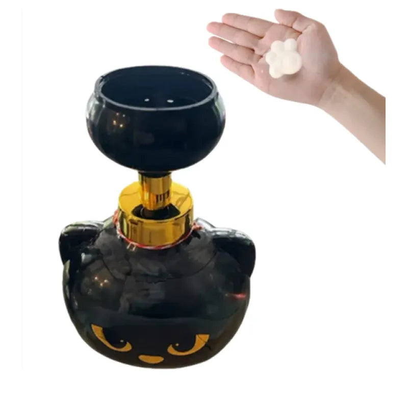 Black cartoon cat-shaped plastic foam soap dispenser, 10cm wide by 18cm tall.