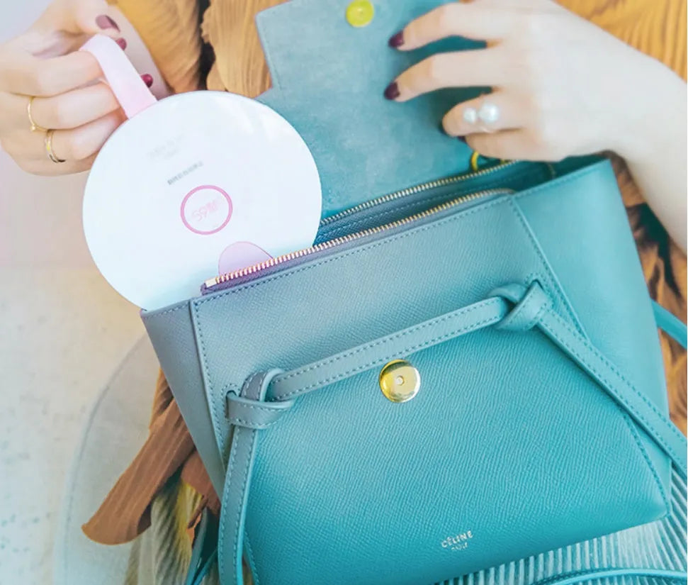 Portable blue UV baby bottle steriliser unit showing compact size and USB charging port.