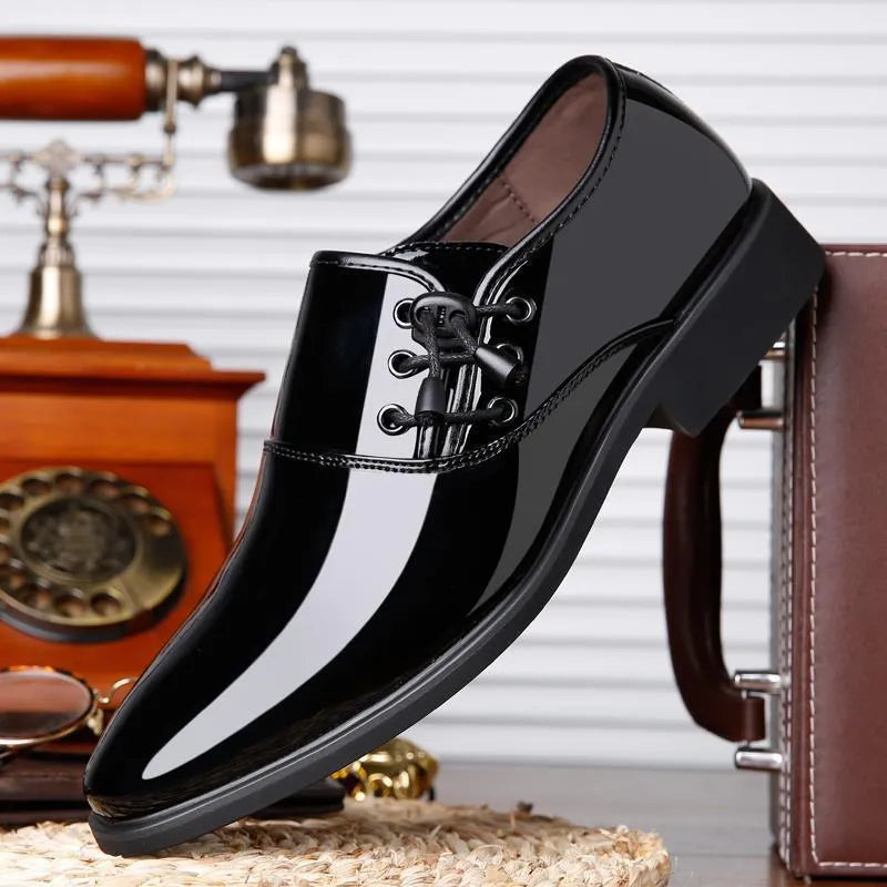 Men's black and brown formal slip-on shoes with round toe and square heel on a rubber sole.