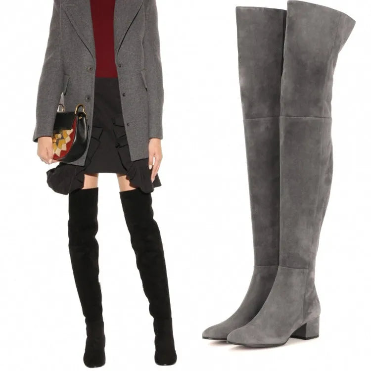 Grey women's suede over the knee flat boots with a chunky rubber sole and pointed toe.