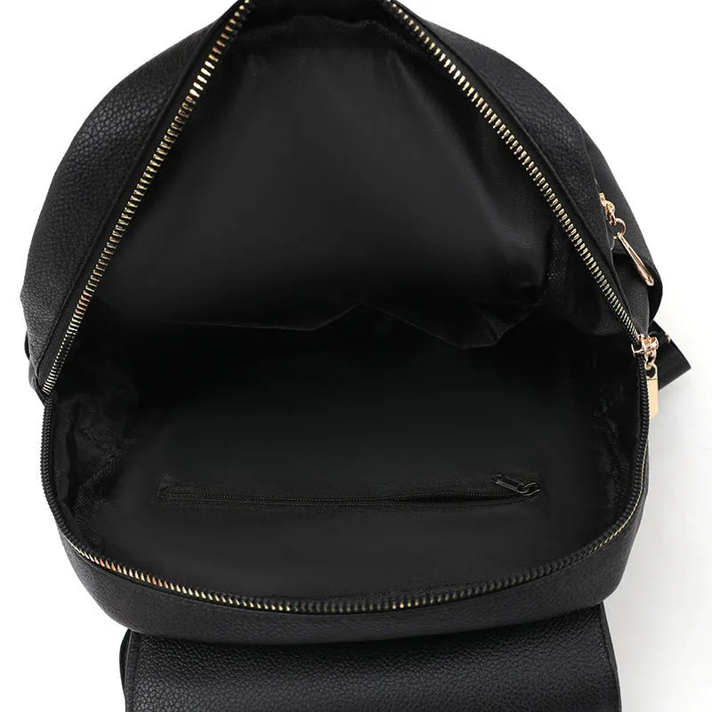 Women's leather backpack with textured material and three-dimensional pockets in street style