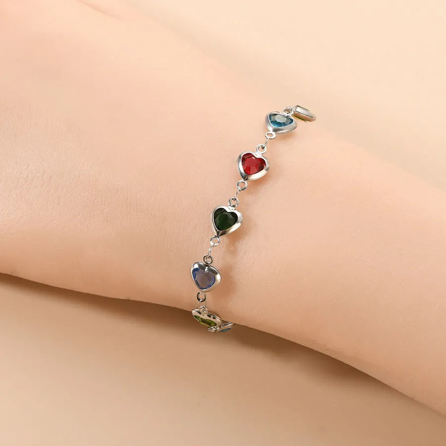 Devil's Eye Creative All-match Fashion Heart Bracelet in stainless steel on a wrist.