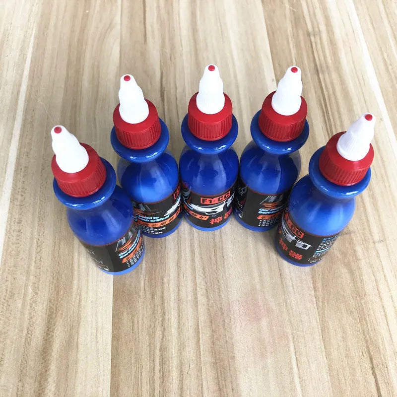 Small blue car wiping tool and 60ml bottle of blue scratch repair agent for vehicles.