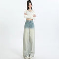 Women's gradient blue straight-leg denim trousers showing wider cut through thigh and calf