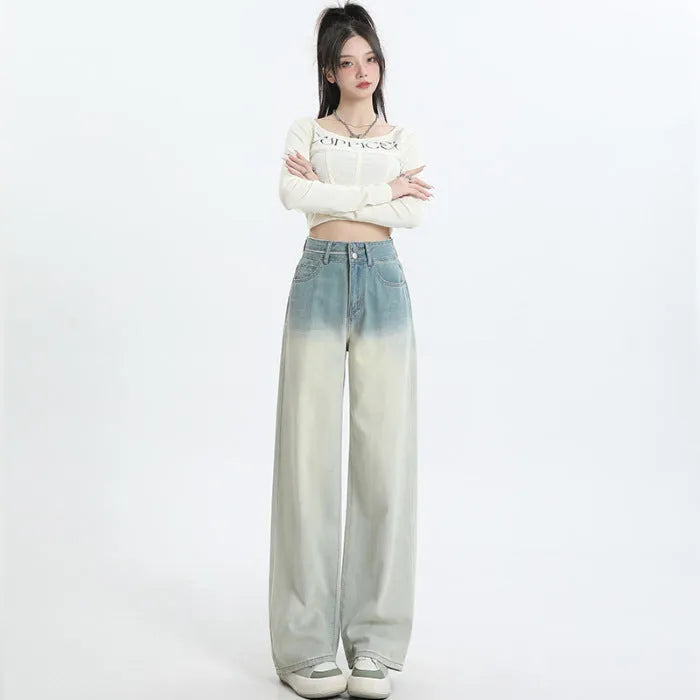 Women's gradient blue straight-leg denim trousers showing wider cut through thigh and calf
