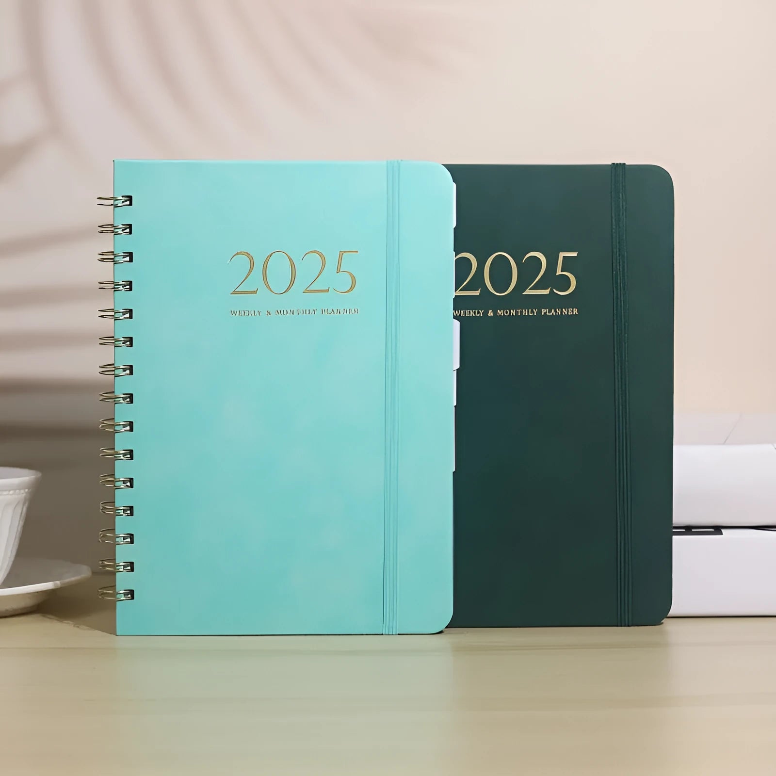 A5 leather notebook with metal coil binding in multiple colour options including black, blue, brown and green.