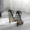 Black suede women's high heel shoes with rhinestone details and a fish mouth open toe.