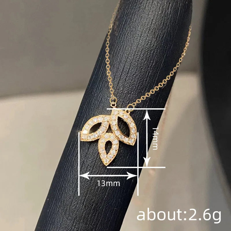 Women's yellow gold copper hollow leaf horse eye pendant necklace with inlaid zircon on adjustable O-ring chain