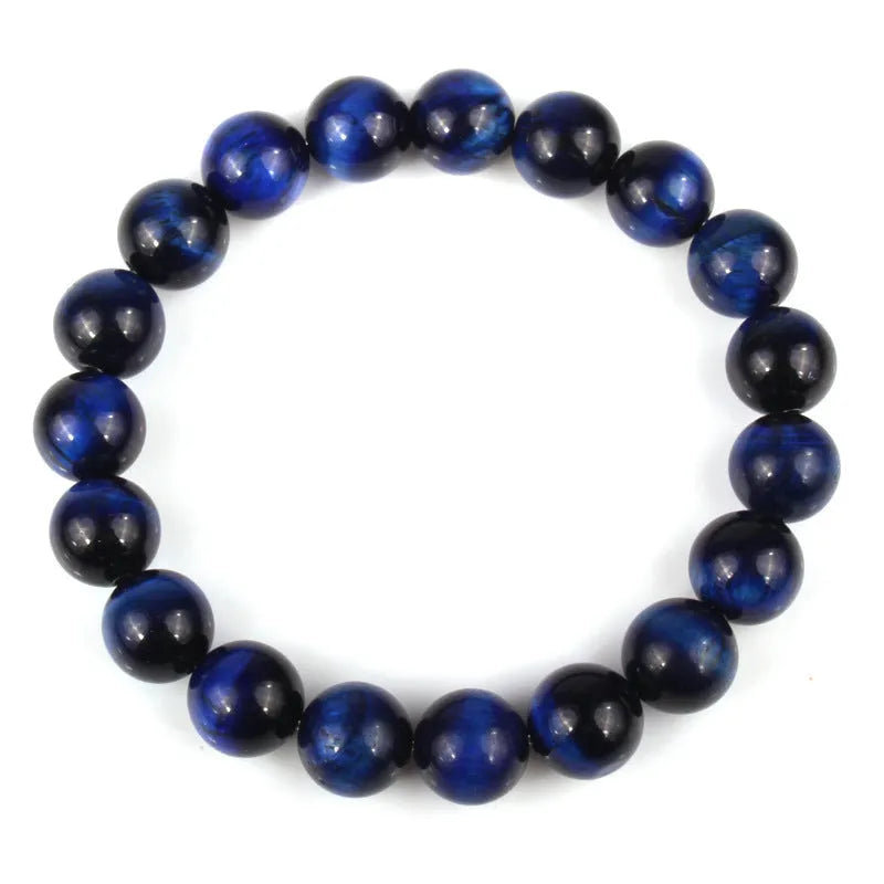 Tigereye crystal bead bracelet showing geometric round beads on a wrist.