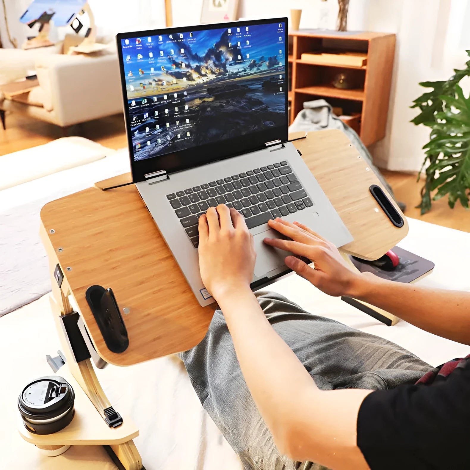 White wooden folding laptop table on bed with adjustable angle mechanism