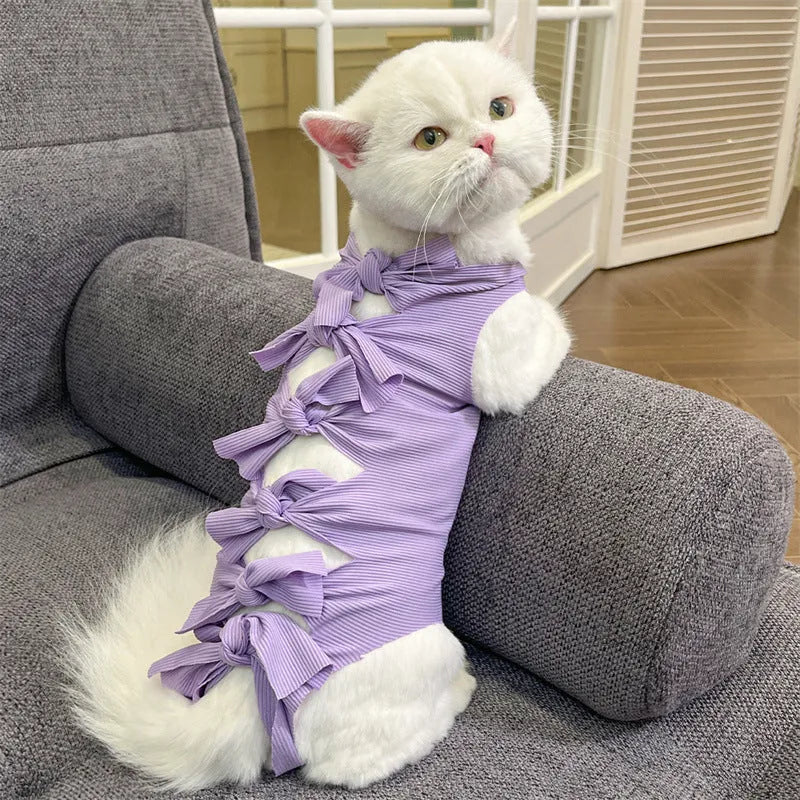 Lace-up polyester recovery clothing for cats after sterilisation, shown in multiple colours and sizes.