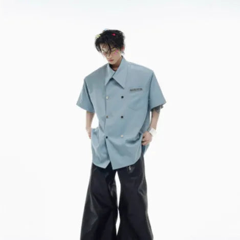 Men's loose fit short sleeve casual shirt with spliced panelling and metal button details.