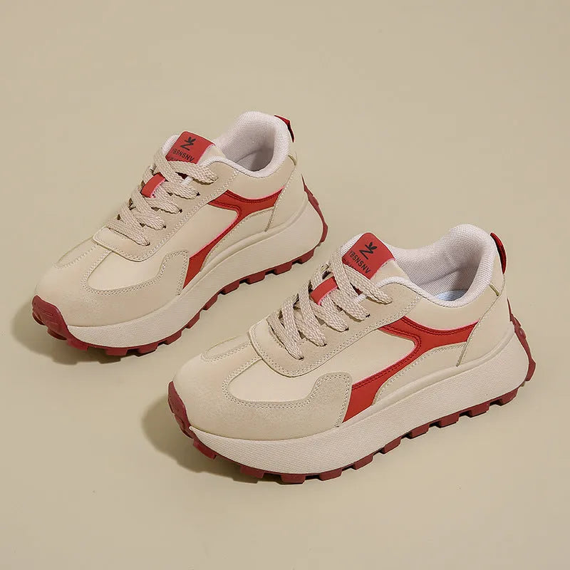 Women's low-top platform sports running shoes in solid colours with flat rubber sole and lace-up front.