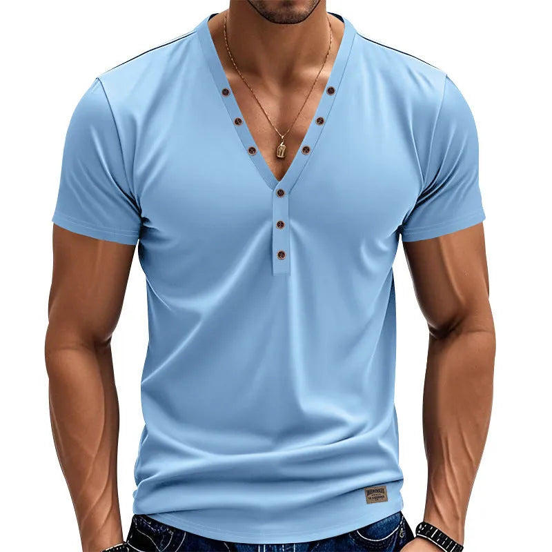 Man wearing a loose fit light blue V-neck button-up sport shirt
