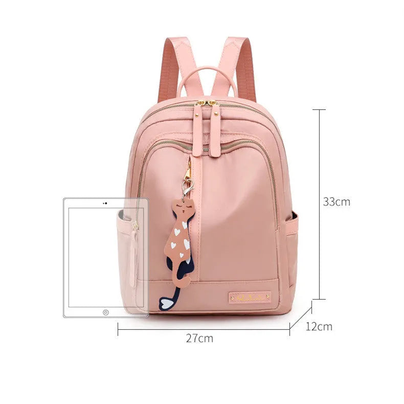 Black or pink casual nylon backpack with waterproof features and organised internal compartments