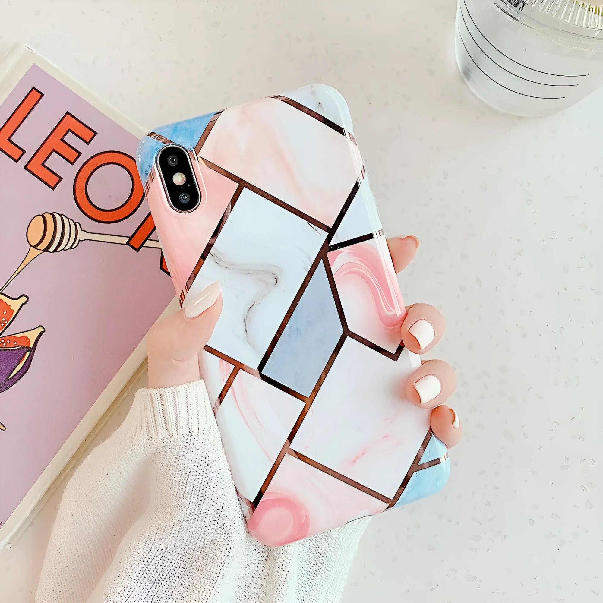 Clear transparent silicone mobile phone case for iPhone on a table.