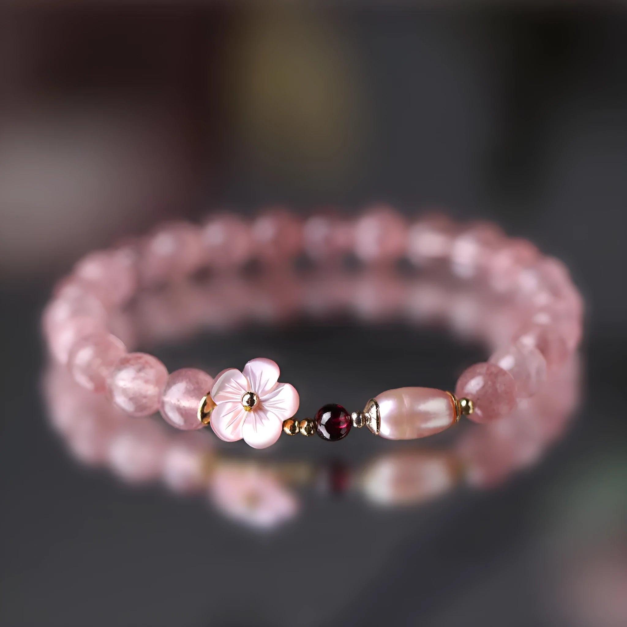 Strawberry quartz crystal flower bracelet with adjustable fastening on wrist