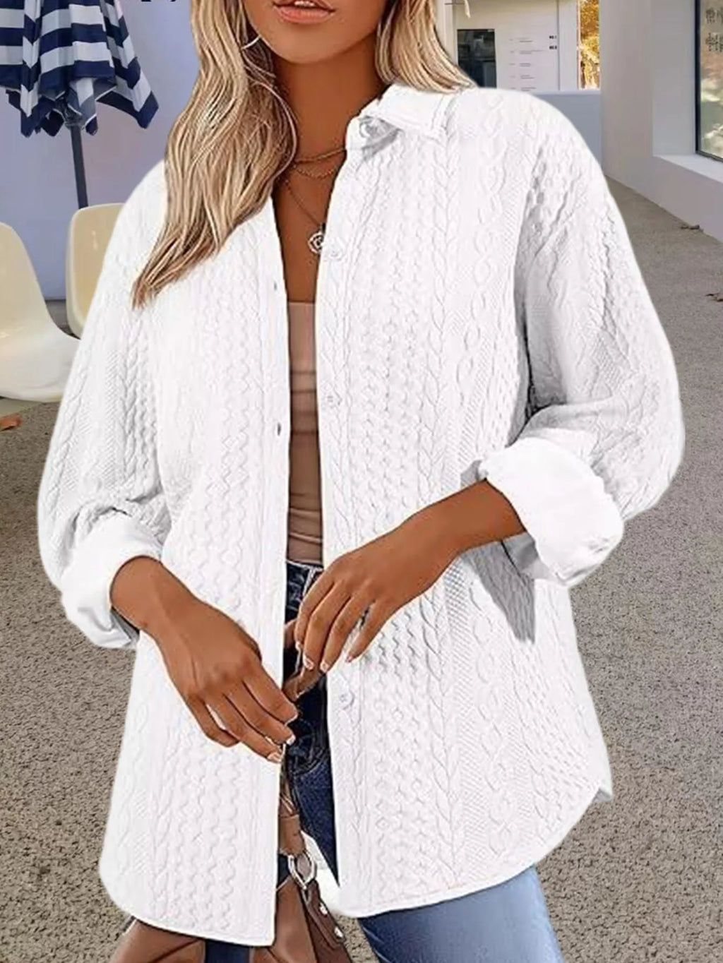 Women's knitted polyester cardigan sweater in black, shown on a hanger.