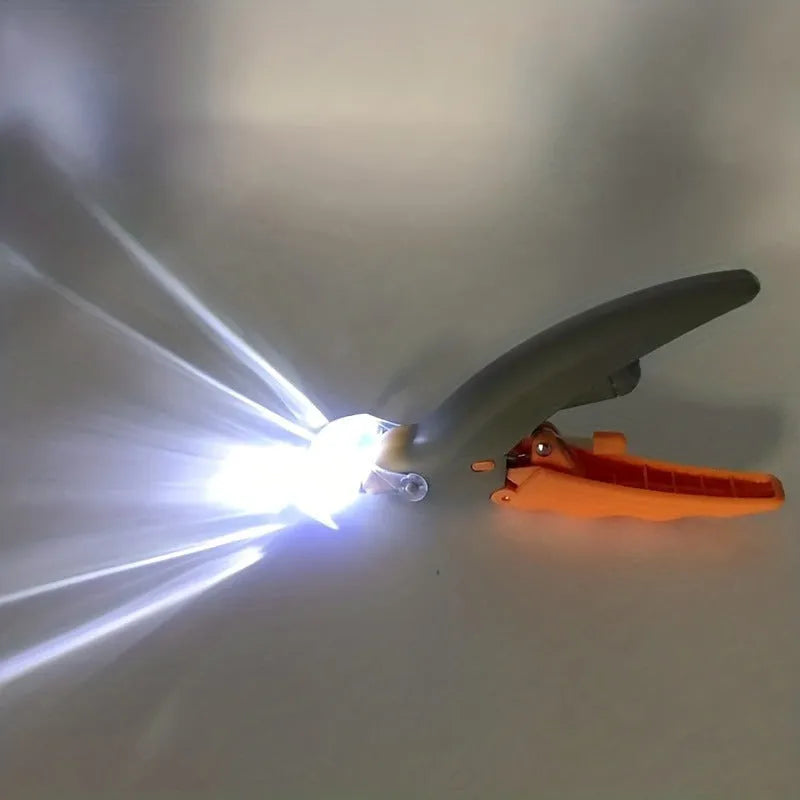 Yellow LED pet nail trimmer with magnifying glass, showing the cutting head and ergonomic handle.