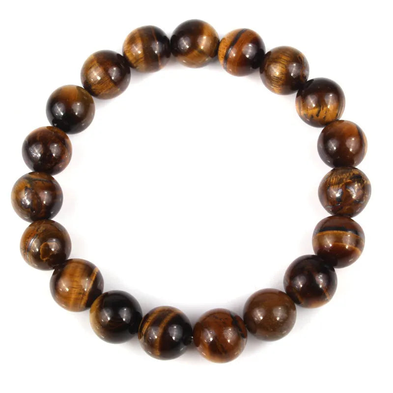 Tigereye crystal bead bracelet showing geometric round beads on a wrist.