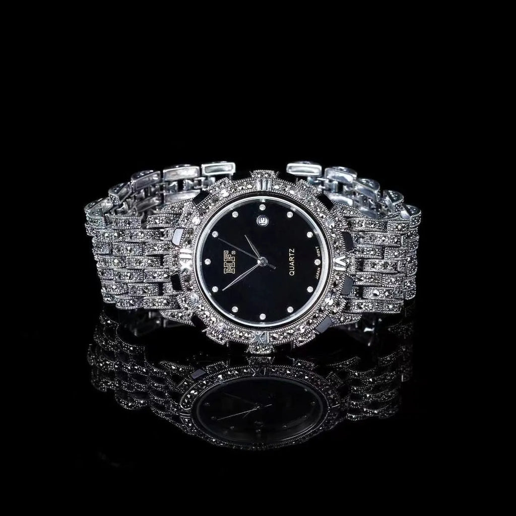 Quartz movement luxury romantic watch with metal strap, round dial, and jewellery buckle in black plate