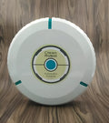 Black or white AC automatic floor sweeping robot on a wooden floor.
