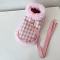 Pink cat costume with cloak and hand holding rope on cat, showing chest and back traction design