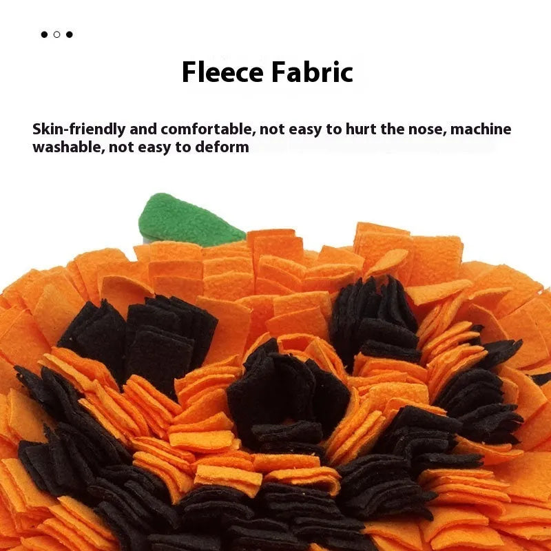 Orange polar fleece pet slow feeder mat with pumpkin-shaped pads for dog or cat food.