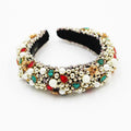 Gold-plated baroque headband with plaid pattern and bow detail on a light background