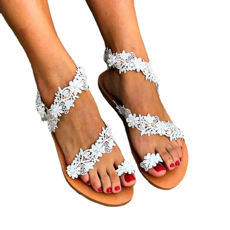 White women's flat sandals with rhinestone flower decoration and elastic back