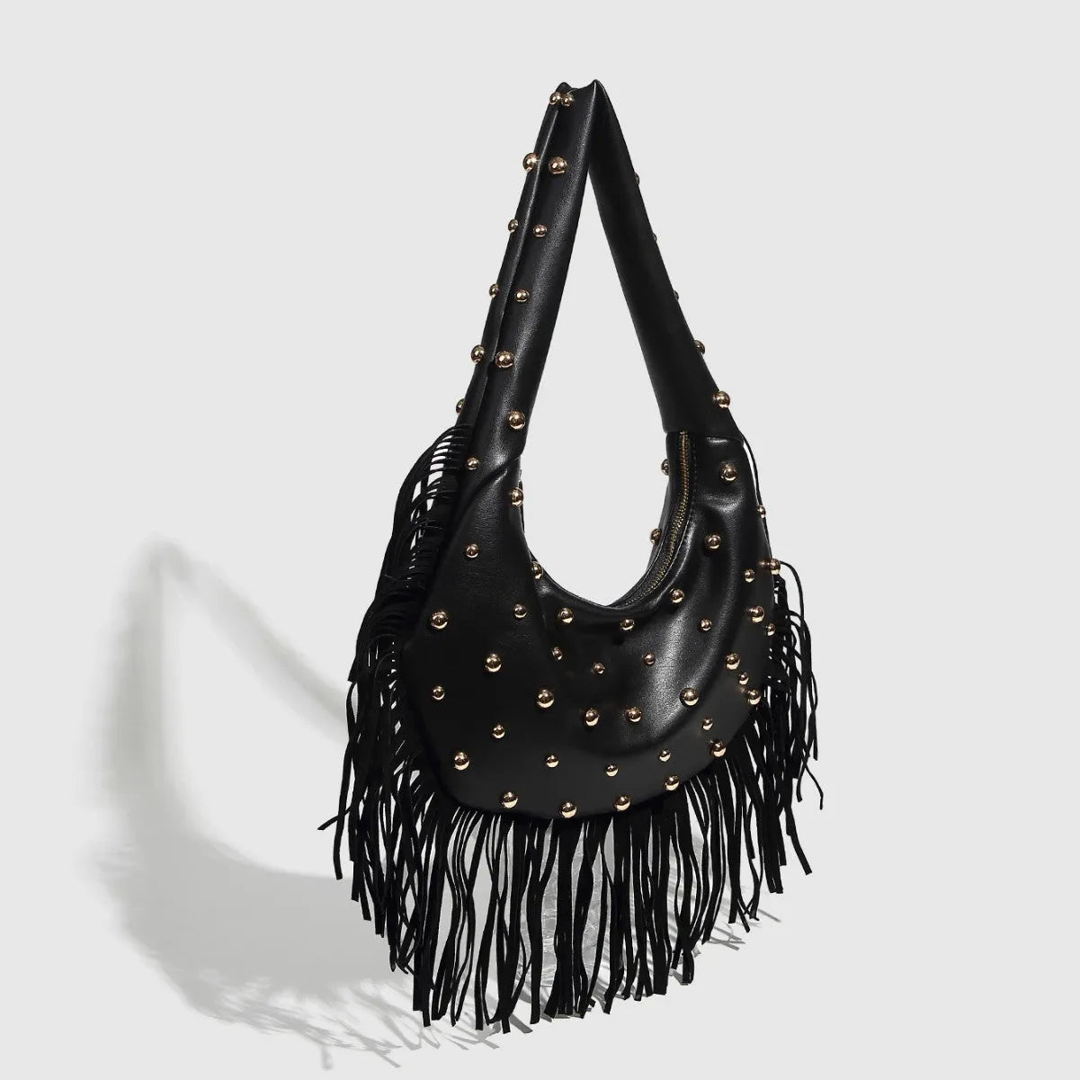 Retro style shoulder handbag with tassel detail in black or wine red colour with internal phone compartment