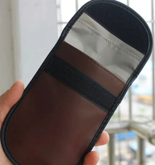 Black microfiber RFID signal blocker bag measuring 13.5 by 9.5 centimetres for car key and card protection