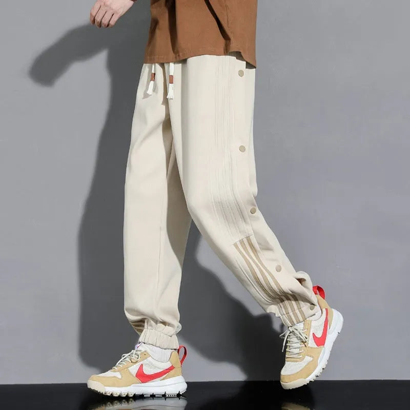 Men's loose fit cotton blend sweatpants with ankle ties and drawstring waistband in black colour