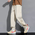 Men's loose fit cotton blend sweatpants with ankle ties and drawstring waistband in black colour