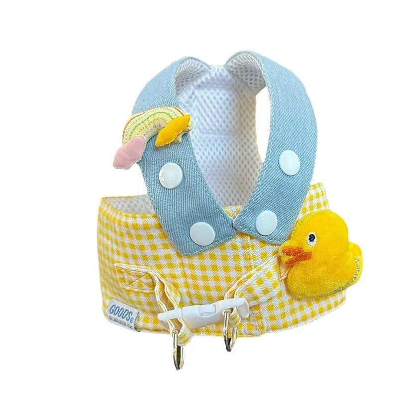 Pet dog harness and leash set with a cute animal hat and a blue tug rope on a green background.