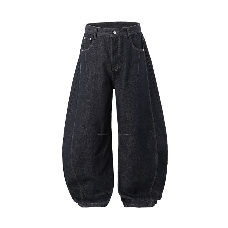Men's wide leg denim trousers in original cow colour on a hanger, showing the relaxed fit and mid waist design.