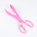 Pet poop clip with long handle tongs in yellow picking up dog waste from grass, 30x10x4cm PVC tool