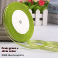 Roll of 0.6cm wide coloured polyester ribbon in onion-dye shades for clothing and gift packaging