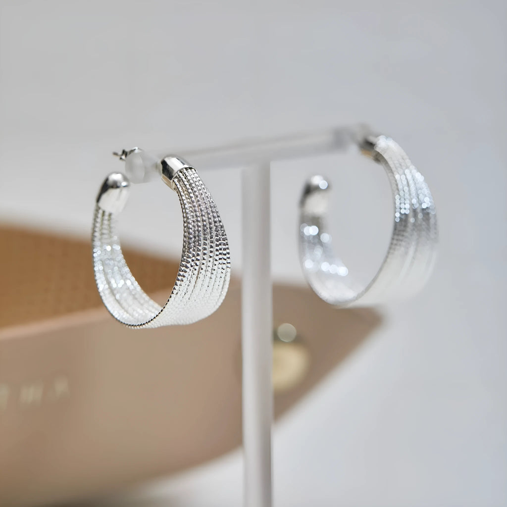 Geometric multi-layer earrings with electroplated gold or silver finish and clip or stud backings