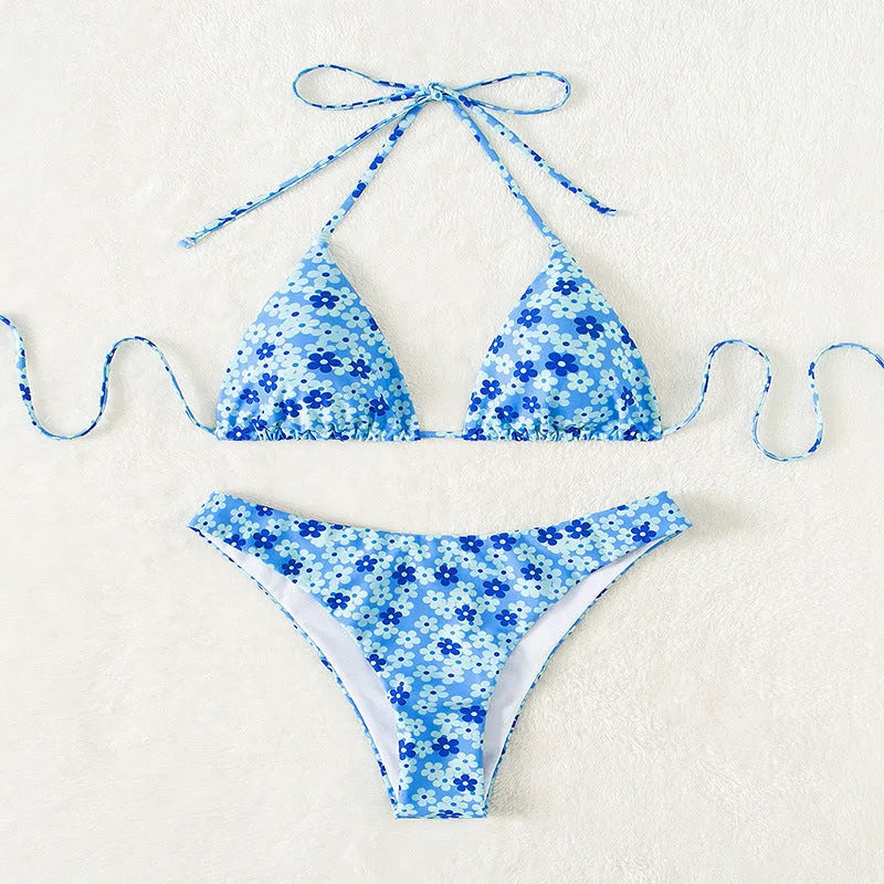 Women's blue printed swimsuit with lace-up front and high-leg split design