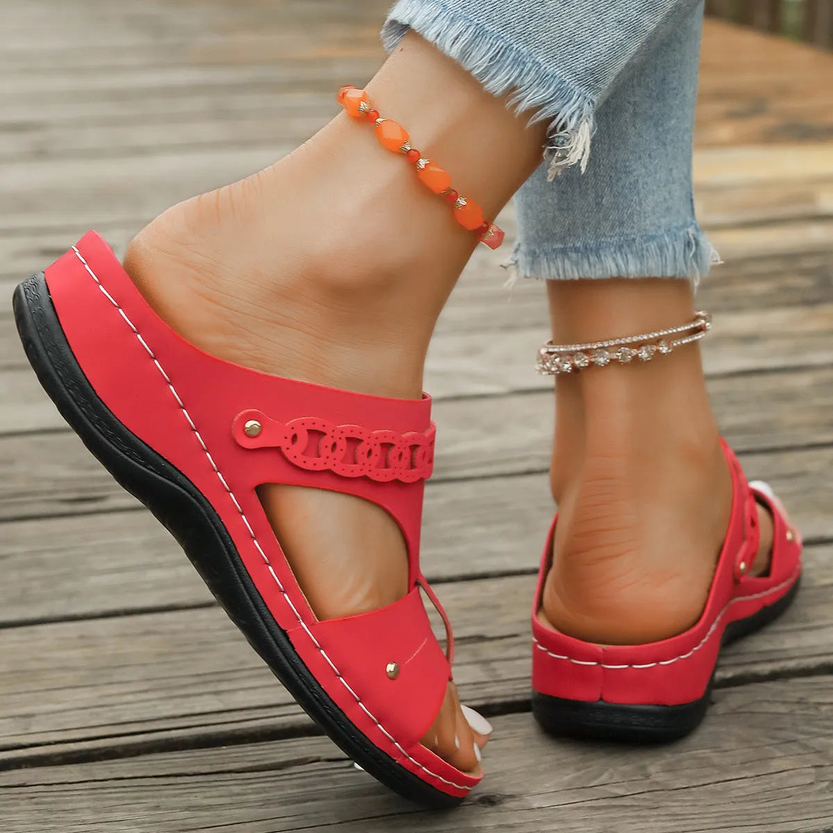 Casual slope heel roman style slippers in blue with fish mouth toe design and rubber sole.