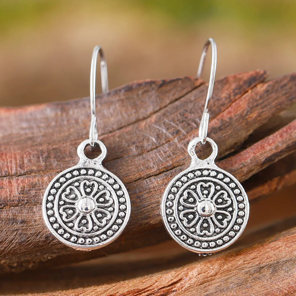 Geometric bohemian style earrings with distressed retro round ethnic print in zinc alloy