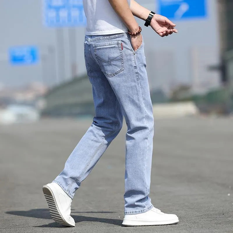 Men's smoky gray straight leg jeans with high elasticity rabbit fur fabric on low waist mannequin